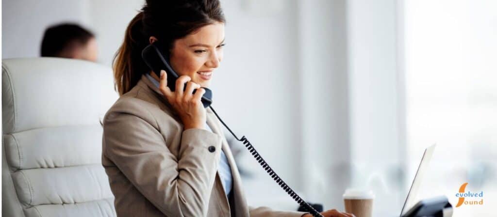 Corporate reception desk with a VoIP phone